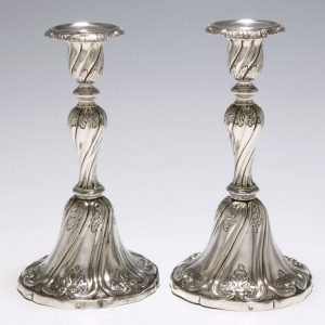 A PAIR OF SILVER CANDLESTICKS
